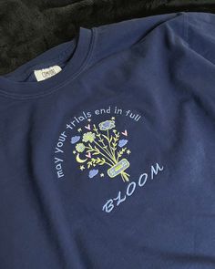 a blue t - shirt with the words new york and in full written on it