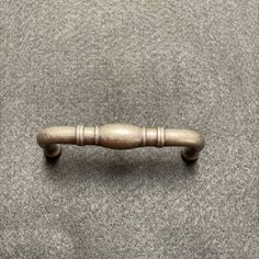 an old wooden handle on the carpet