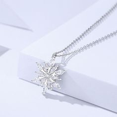 Description & Details Embrace the enchanting beauty of winter with our intricately crafted pieces inspired by the delicate and unique snowflakes. Each design in our collection captures the mesmerizing allure and symbolism associated with these crystalline wonders. • Material: Solid 925 Sterling Silver ∙ Cubic Zirconia• Finish: Hypoallergenic ∙ Gold Plating• Dimensions: 14 x 16 mm pendant, 40 - 45 cm chain, adjustable• All our work is custom made by hand with love Elegant Snowflake Shaped Cubic Zirconia Jewelry, Sterling Silver Snowflake Jewelry For Winter, Snowflake Shaped Sparkling Sterling Silver Jewelry, Sparkling Snowflake Jewelry In Sterling Silver, Sparkling Snowflake Sterling Silver Jewelry, Christmas Silver Cubic Zirconia Necklace, Silver Snowflake Necklace With Cubic Zirconia, Fine Jewelry Snowflake Cubic Zirconia, Silver Cubic Zirconia Snowflake Necklace