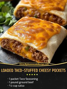 two taco - stuffed cheesy pockets are sitting on a black platter