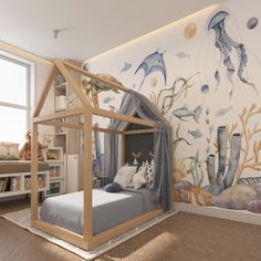 a child's bedroom with an ocean theme painted on the wall and under the bed