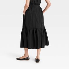 Add feminine flair to your wardrobe with this Tiered Maxi Skirt from Universal Thread™. Fashioned in a solid shade, this maxi skirt is tailored with a two-tiered silhouette with soft pleats and a high-rise cut. The lightweight cotton construction offers breathable comfort, while the elastic waistband gives a snug, secure fit. Plus, side pockets offer convenient space for your on-the-go essentials. Universal Thread™: Found exclusively at Target.