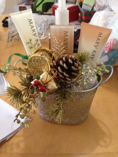 a glass container filled with christmas items on top of a table