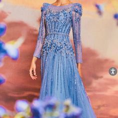 Step Into A Fairy Tale With The Exquisite Azurite Embellished Gown. This Gorgeous Gown Features Intricate Beading And Delicate Embellishments That Give It A Whimsical, Romantic Touch. The Stunning Layered Glitter Tulle Creates An Ethereal Effect That Will Make You Feel Like A Real-Life Queen. Its Belted Waistline Adds Structure To This Magical Dress, Perfect For Any Dreamy Or Enchanted Occasion. Bring Your Fairy Tale To Life In This Long Sleeve Beauty. ***Please Make Sure To Measure Yourself Bef Blue Floral Embellished Evening Dress For Gala, Blue Floral Embellished Gown For Gala, Luxury Blue Gown For Banquet, Blue Floral Embellished Evening Gown, Blue Floral Embellished Floor-length Evening Dress, Glamorous Blue Embellished Gown, Blue Rhinestone Evening Gown, Blue Evening Dress With Rhinestones, Blue Embellished Dress For Gala