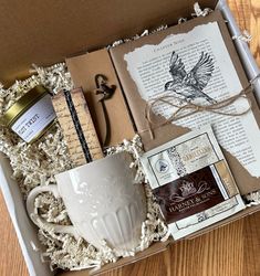 an open box containing coffee, books and other items