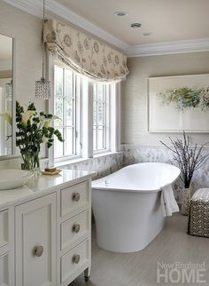 a bathroom with a tub, sink and window in it's centerpiece is featured on instagram