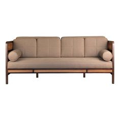 a beige couch sitting on top of a wooden frame