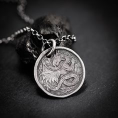 Handmade Sterling Silver 925 Dragon necklace. The silver necklace was oxidized to create more antique rustic look. A dragon necklace often symbolizes power, protection, and a connection to the mystical. It may represent strength, wisdom, and aspirations, reflecting personal qualities such as resilience and leadership. The specific symbolism can vary based on cultural influences and individual interpretations. It is a unisex necklace so it fits both men and women. ❤  Every piece is a unique artwo Symbolic Dragon Design Round Pendant Necklace, Vintage Dragon Design Jewelry For Gifts, Vintage Dragon Design Jewelry Gift, Vintage Jewelry With Dragon Design Gift, Vintage Jewelry With Dragon Design For Gift, Dragon Design Amulet Jewelry As Gift, Dragon Design Amulet Jewelry Gift, Antique Dragon Design Jewelry For Gift, Antique Dragon Design Jewelry Gift