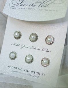 four pairs of pearl studs in white packaging