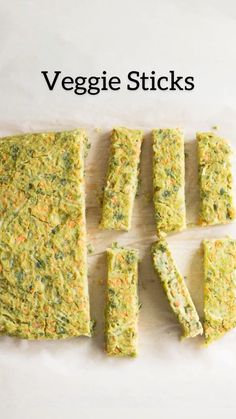 veggie sticks cut into squares on a cutting board with the words vegan written above them