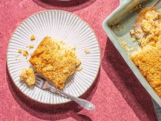 a piece of cake on a plate next to a pan with another pie in it