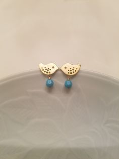 This sweet personalized birthstone earrings will give whole lot of meaning to special someone as a gift or to keep it yourself two beautiful love birds cut out of brass adorned with swarovski birthstone and connected to sterling silver post. bird measures 10mm x 6mm very cute look in my store for matching necklace available in bigger size 17mm x 10mm: https://www.etsy.com/listing/62790829/september-birthstone-post-earrings https://www.etsy.com/listing/62525570/birthstone-16k-gold-plated-love-bir Cute Turquoise Jewelry As A Gift, Cute Turquoise Jewelry For Gift, Cute Turquoise Jewelry For Gifts, Cute Turquoise Jewelry Gift, Cute Hypoallergenic Turquoise Jewelry, Bird-shaped Jewelry Set With Matching Earrings, Earrings White Gold, Birthstone Earrings, Earrings Turquoise