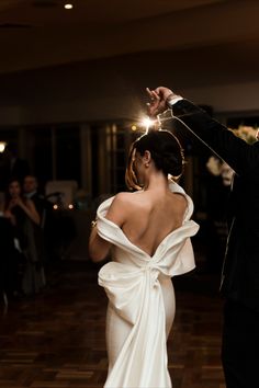 a bride and groom dancing at their wedding reception