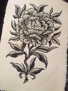 a black and white drawing of a flower