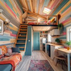 the interior of a tiny house with colorful walls