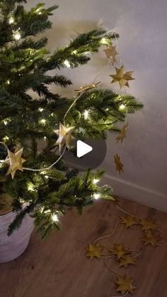 a christmas tree is decorated with gold stars