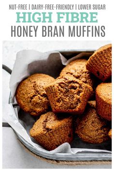 a bowl filled with muffins on top of a white tablecloth and text overlay reads, high fiber honey bran muffins