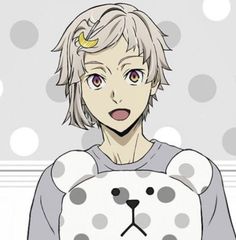 an anime character holding a teddy bear in front of a black and white circular background