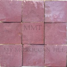 some pink tiles with the words mmt on them