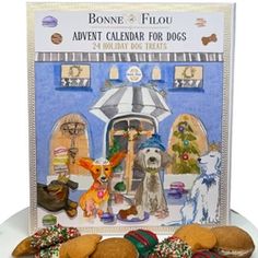 a card with some dogs and cookies on the front, in front of it is an advertisement for a holiday treat