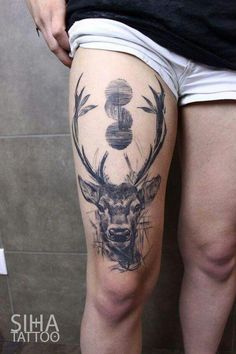 a man with a deer tattoo on his thigh