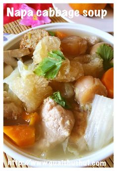 a white bowl filled with meat and vegetables