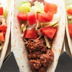 three tacos filled with meat and veggies