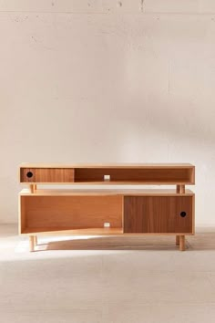 the sideboard is made out of wood and has two drawers on each side, one with