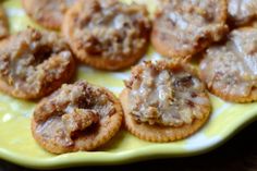 small pastries are sitting on a yellow plate