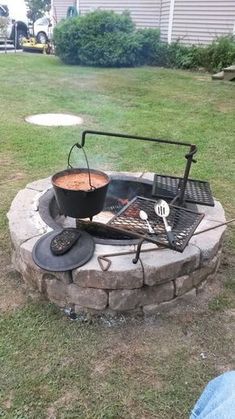 an outdoor bbq grill is set up in the yard