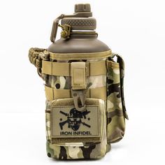 the back side of a flask bottle with a camo pattern and an emblem on it