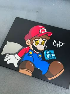 an image of a painting of mario on the ground