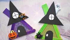 two paper houses made to look like witches