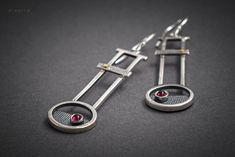 Red Garnet Drop Earrings. An intriguing piece of jewelry. These long geometric earrings measure 6cm in length including the hook. Made from sterling silver 925 and details of 22k Gold. An exclusive and glamorous piece of jewelry. Check this one also: https://www.etsy.com/listing/897312374/carnelian-drop-earrings-gemstone?ref=shop_home_active_60&frs=1 Get a 10% discount off your next order by subscribing at Diapiro's newsletter. Link for coupon code https://mailchi.mp/56f529763263/diapiro All of Modern Linear Drop Earrings For Jewelry Making, Modern Handmade Long Drop Linear Earrings, Modernist Drop Earrings As A Gift, Red Garnet Drop Earrings, Silversmith Jewelry, Garnet Drop Earrings, Red Garnet Earrings, Art Jewelry Earrings, Silversmith Jewellery