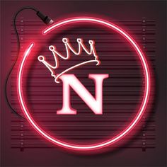 a neon sign with the letter w in it's center and a crown on top