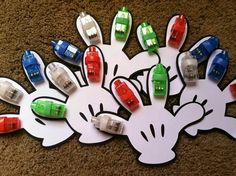 a bunch of cars that are in the shape of mickey mouse's head on top of a white piece of paper