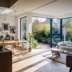 a living room filled with furniture and lots of windows