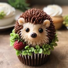 there is a cupcake decorated like a hedge