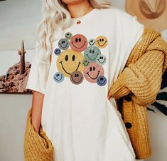 Bring back the good vibes with our All the Smiles Retro tee. This unisex short sleeve tee features a colorful retro print that will have you smiling all day long. Perfect for any casual occasion, this tee will add a touch of fun and nostalgia to your wardrobe. Smiley Face Graphic, Graphic Tees For Women, Face Graphic, Oversized Graphic Tee, Retro Tee, Shirts For Teens, Tees For Women, T Shirt Oversized, Retro Prints