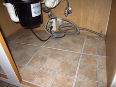 an electrical outlet in the corner of a kitchen