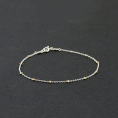 This Dainty Mixed Metal Bracelet is handcrafted for you with great care from high-quality 14K Gold Filled and 925 Sterling Silver. The bracelet has a delicate and minimal look and will be a perfect addition to all your outfits. Two metals combination creates a beautiful and unique contrast! MATERIALS AND SIZE ◆ Metals - 14K Gold Filled, 925 Sterling Silver  LINK FOR PURCHASING MATCHING NECKLACE https://www.etsy.com/ca/listing/1065702769 GIFT AND PACKAGING ◆ All jewelry is packed beautifully in a Mixed Metal Bracelet, Beaded Chain Bracelet, Bracelets Simple, Two Tone Bracelet, Mixed Metal Bracelets, Bracelet Layering, Minimal Bracelet, Bracelet Minimalist, Metal Bracelet