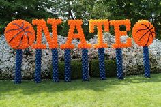 an inflatable sign with basketballs on it