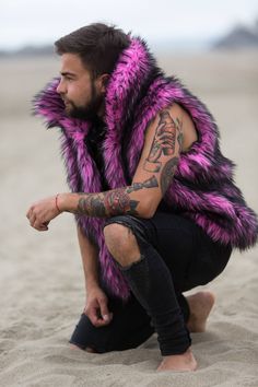 Pink Panther Festival Vest Envelop yourself in the playful allure of the 'Pink Panther' festival vest, a snuggly companion for festival frolics under the moonlit sky. Whether you're prowling the Playa or lost in a forest rave, this vest's vibrant faux fur is your bold statement piece, bursting with the primal energy of its namesake feline. Choose from three enchanting linings: 'God's Venus' mimics the intricate tapestries of ancient deities, 'Disco Ball' reflects your inner party spirit with a g Sleeveless Winter Vest For Festivals, Pink Fitted Vest For Winter, Winter Festival Outerwear Vest, Pink Festival Outerwear, Festival Vest, Lightning In A Bottle, Moonlit Sky, Pink Panther, Cold Nights