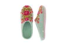 If in between sizes, size up Sold in sizes XS (6), S (7), M (8), L (9), XL (10). Take your lovely garden inside with you with these elegant Secret Garden Slippers. Inspired by ornate vintage slippers from the 1920s, each one is hand felted and hand embroidered by artisans in Nepal. Featuring intricate and bright floral embroidered designs that pop against the bright wool. 100% wool and leather sole. Hand Accessories, Wool Slippers, French Knot, Leather Slippers, Hand Felted, Seasonal Gifts, Rose Print, Embroidered Design, Secret Garden