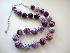 "Deep rich hues of purple and white faceted cracked agates sparkle as they move, each one separated by gorgeous crystals. This is a spectacular piece and one that should be seen to appreciate. This necklace hangs 22-27\" closes with a lobster clasp." Handmade Leather Purse, Wine White, Jewelry Purple, Purple Wine, Necklace Purple, Purple And White, Leather Tassel, Bride Wedding, Wedding Necklace