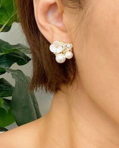 This item is excluded from all promotions and coupons. Add a touch of magic to your outfit with our Mini Flower Jeweled Stud Earrings. These elegant earrings feature a stunning flower design with sparkling details and a delicate pearl accent. They are the perfect accessory to add some sparkle and charm to any look. White Clip-on Flower Earrings, White Flower Clip-on Earrings, White Pearl Clip-on Earrings, Feminine White Flower Earrings With Pearl Drop, Feminine White Pearl Flower Earrings, Feminine Pearl White Bridal Earrings, White Feminine Bridal Earrings, Elegant Clip-on Earrings With Flower Charm, White Pearl Clip-on Earrings With Pearl Charm