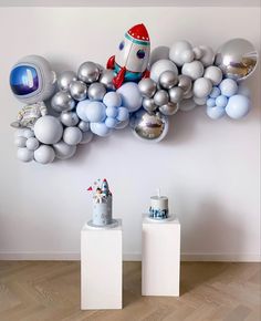 an image of balloons on the wall with a stuffed animal