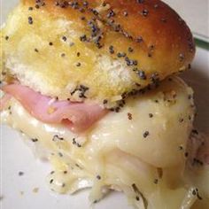 a ham and cheese sandwich is on a plate