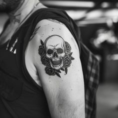 Black and white skull and rose tattoo on upper arm, symbolizing life and death, intricate design with hollow features and roses, monochrome palette for bold statement Tattoo On Upper Arm, Monochrome Palette, Upper Arms, A Skull, Bold Black