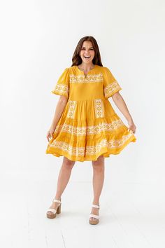 Features Notched Vneck Embroidered Tiers Dress: 100% Cotton, Lining: 95% Polyester 5% Spandex Size + Fit Small 0-4, Medium 4-8, Large 8-12 Model is 5'4" and wearing a small Runs true to size Bust Measurements are taken while laying flat and doubled Size Bust Length Small 34" 36" Medium 36" 36" Large 38" 37" V-neck Embroidered Dress With Embroidered Neckline, Embroidered V-neck Dress, Flowy V-neck Embroidered Dress, Casual V-neck Dress With Embroidered Neckline, Casual V-neck Dress With Embroidered Hem, Casual Embroidered V-neck Dress, Vacation V-neck Dress With Embroidered Hem, Casual V-neck Embroidered Summer Dress, Casual Embroidered Mini Dress